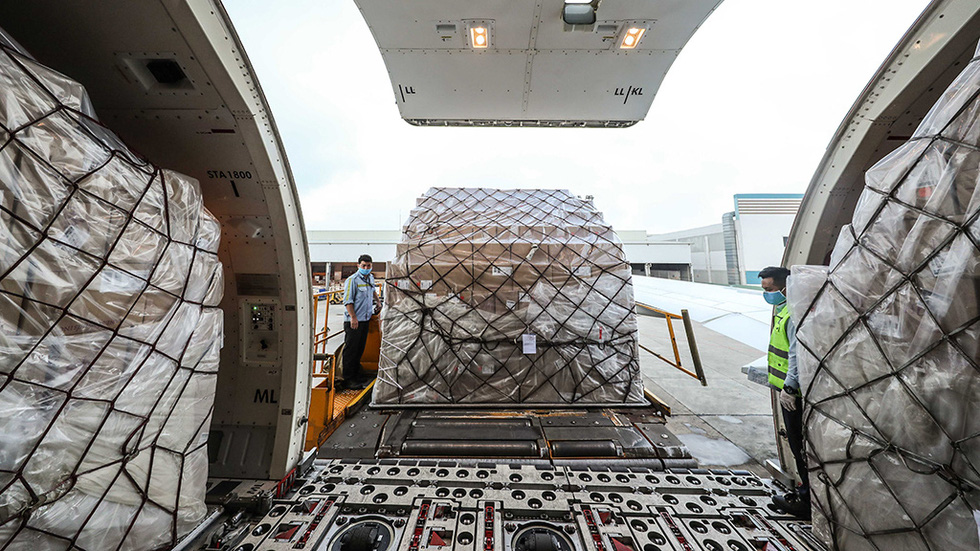 The packages are housed in the cargo holds of the transport planes, each small with about 500 masks